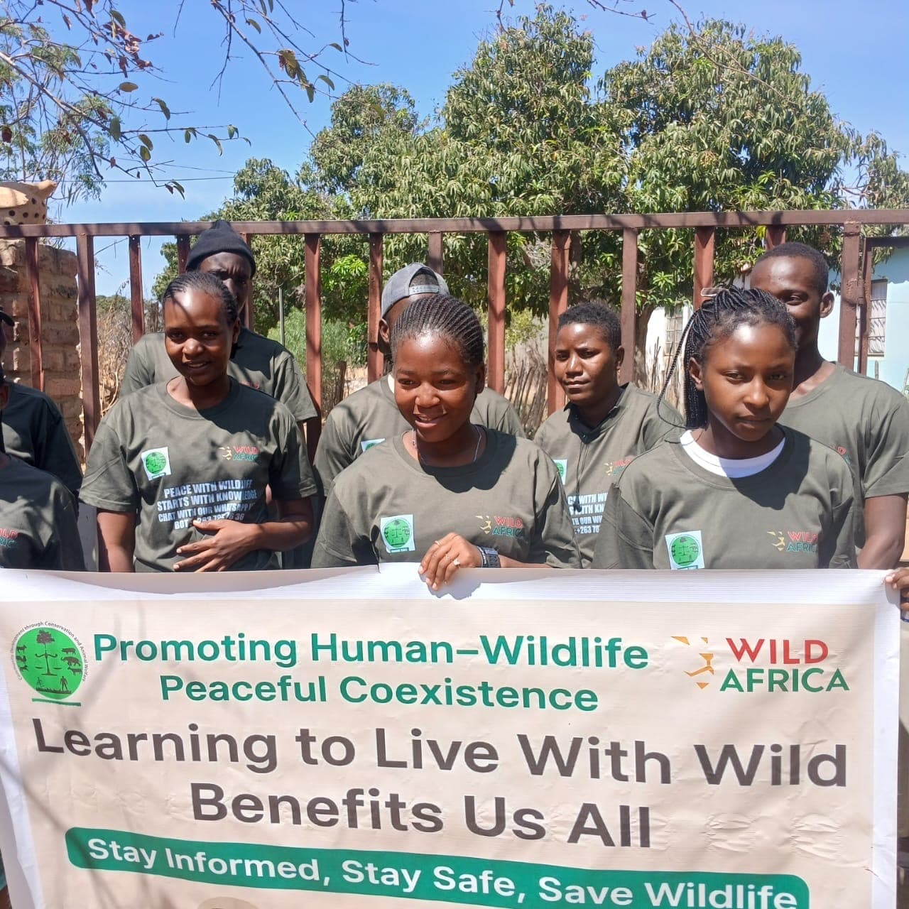 A group displaying a peaceful coexistence banner