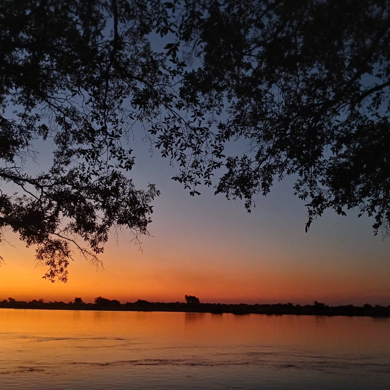 An orange evening sky over water