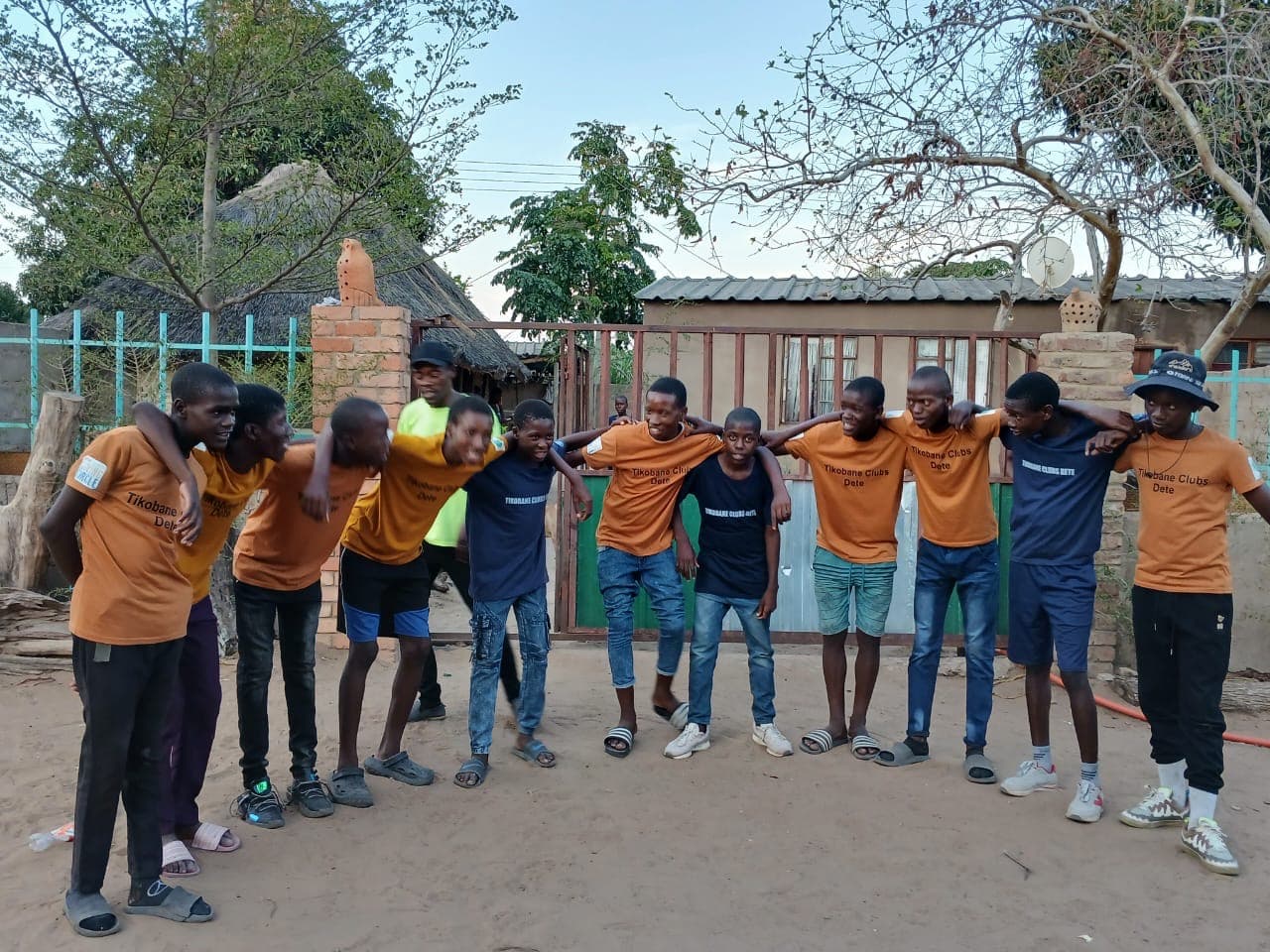 Young people standing together in a circle