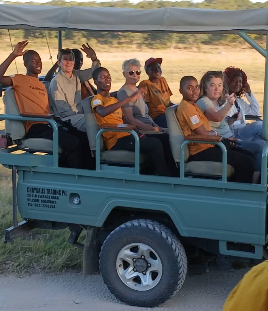 Youth group in an open safari vehicle