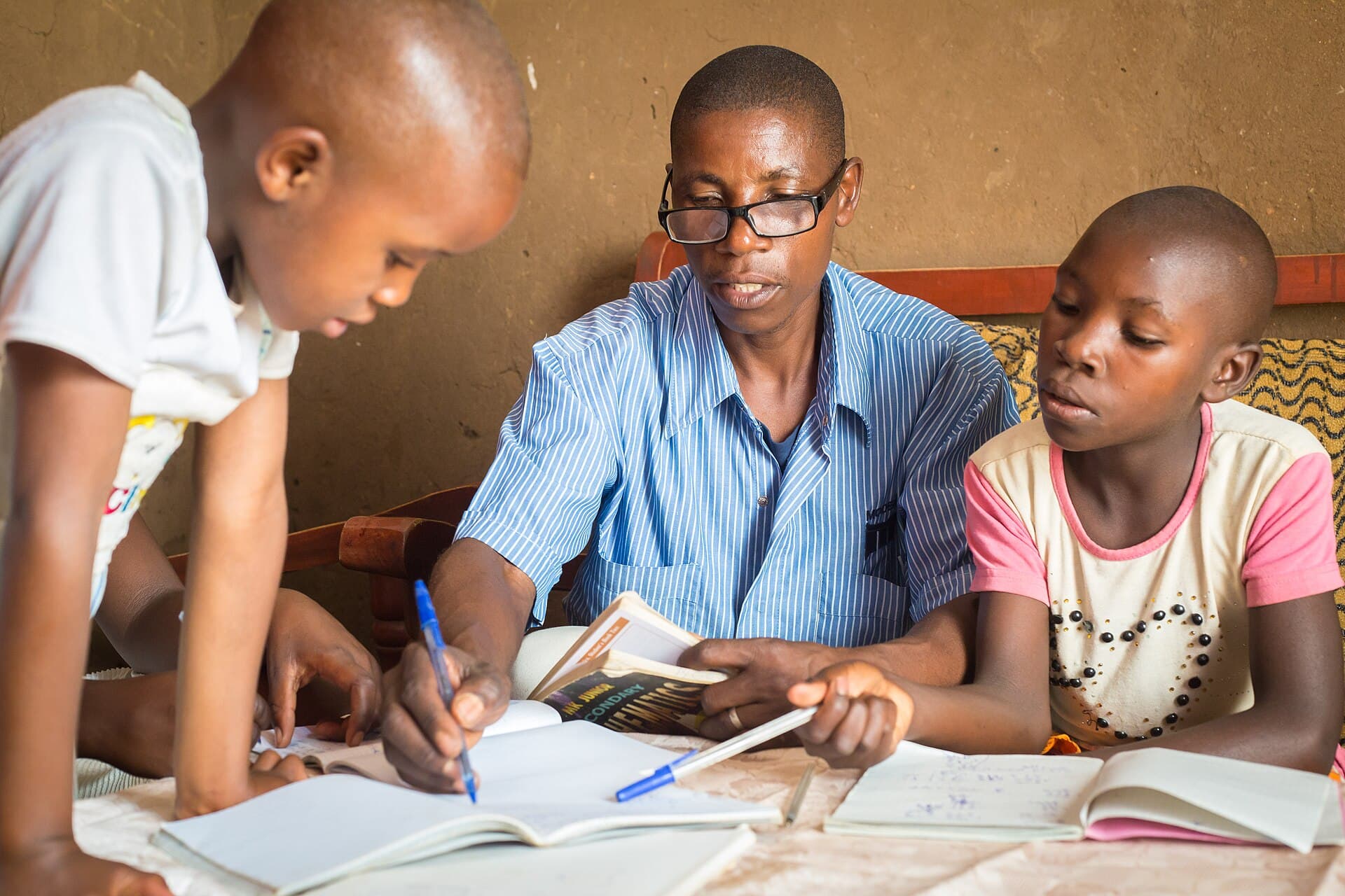 A teacher working with children in Zimbabwe